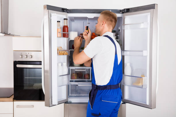 technician-repairing-refrigerato-2.png